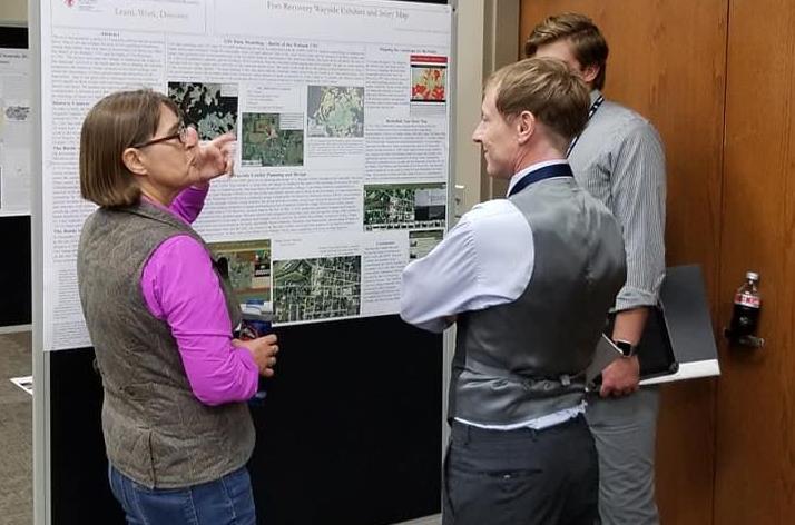 Archaeologist, Christine Thompson, presenting poster
