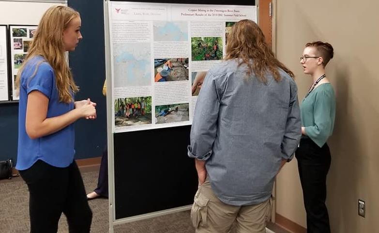 Lindsey Cron (Senior) and Charity Munro (recent Graduate) present poster