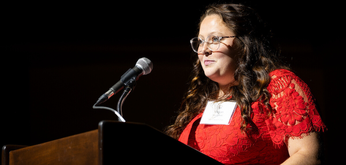 Talent Search 2024 committee member speaking at the podium