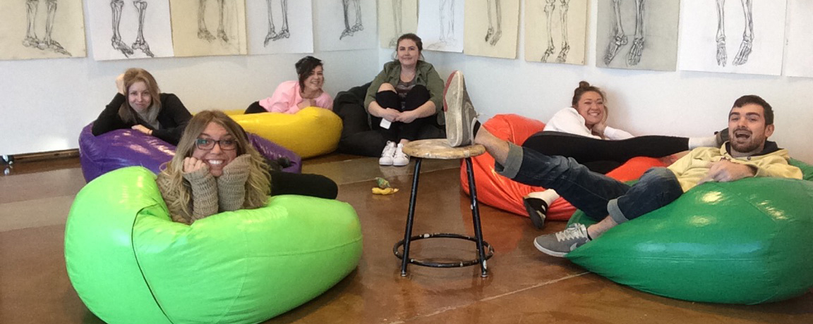 Art student group sitting on beanbag chairs