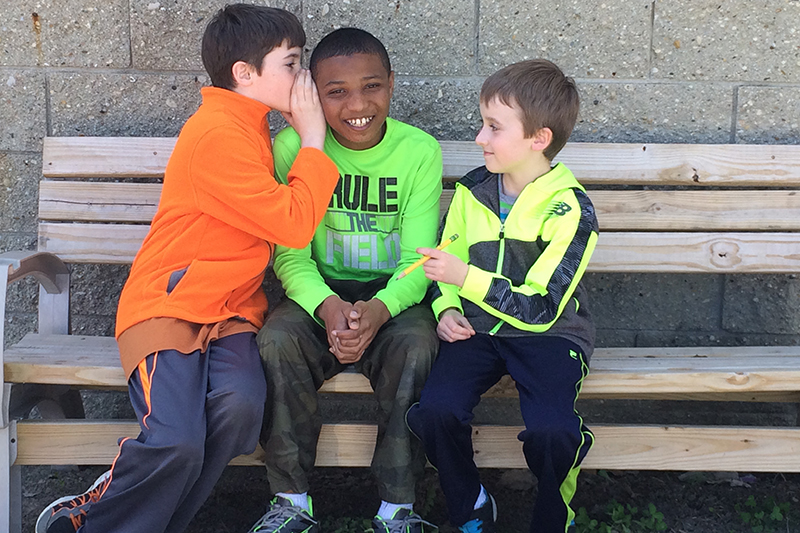 Children seated on a bench