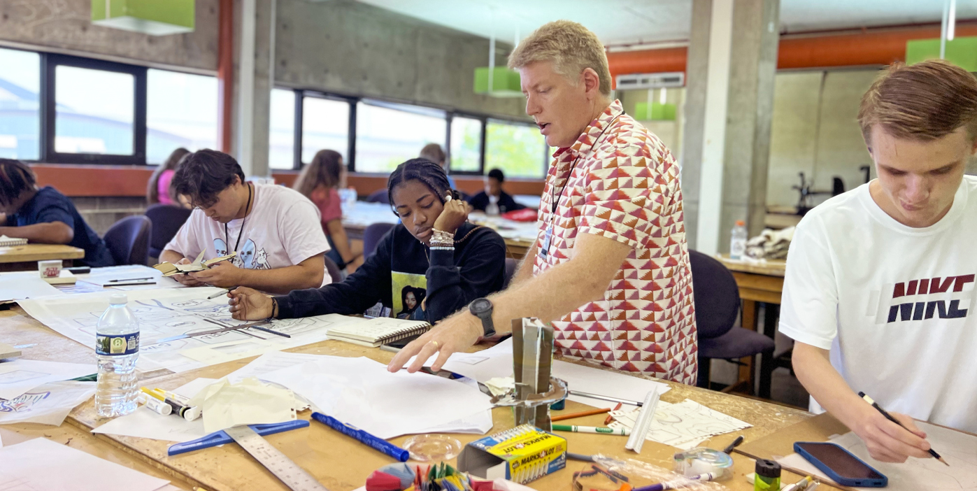 Students with faculty member at camp