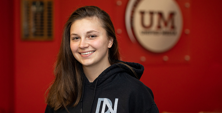 School of Journalism and Strategic Communication student Meghan Sawitzke stands in the Unified Media Lab. 