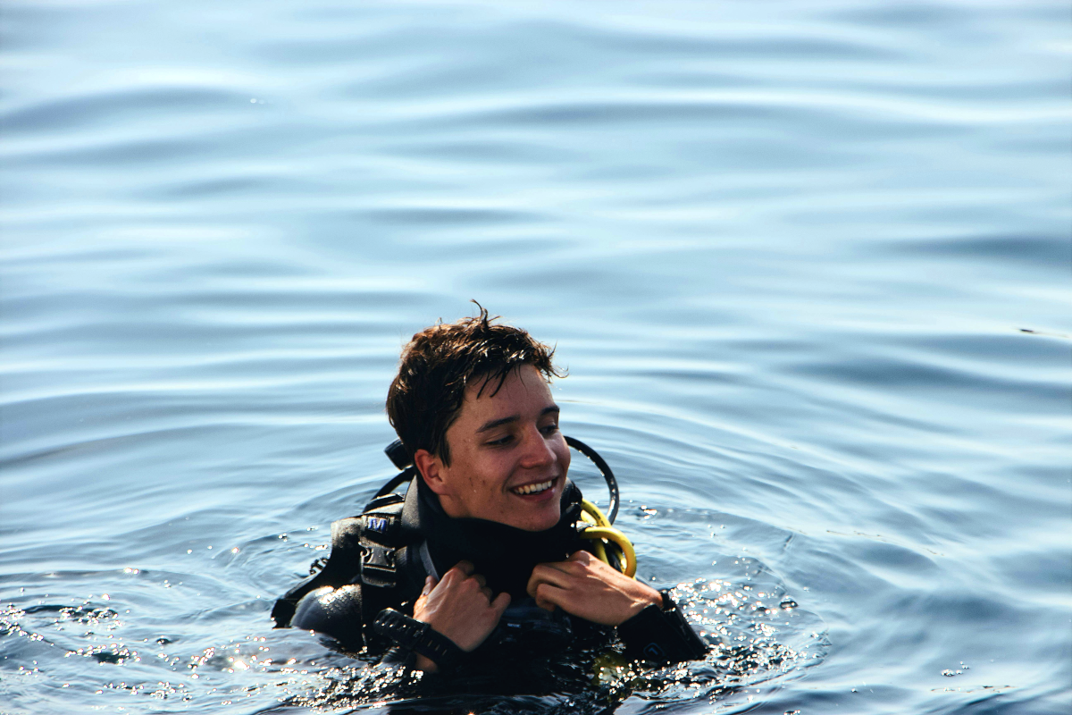 A young man scuba diving