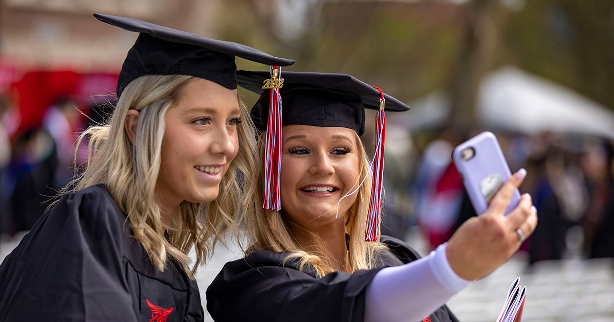 Two Ball State graduates taking a selfie - Ball State University Spring 2022 Commencement