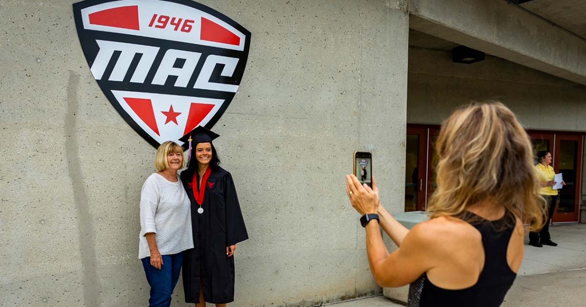 Student posing with mother