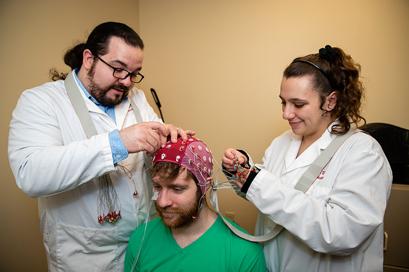 Counseling psychology students working with a patient.