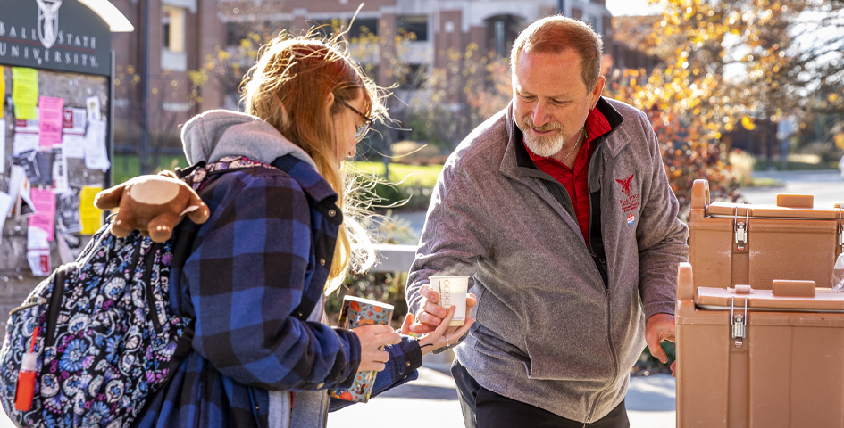 first-generation celebration event student with faculty member
