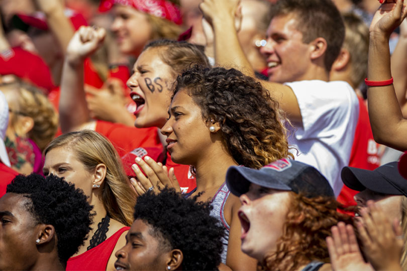 Students at a football game cheering