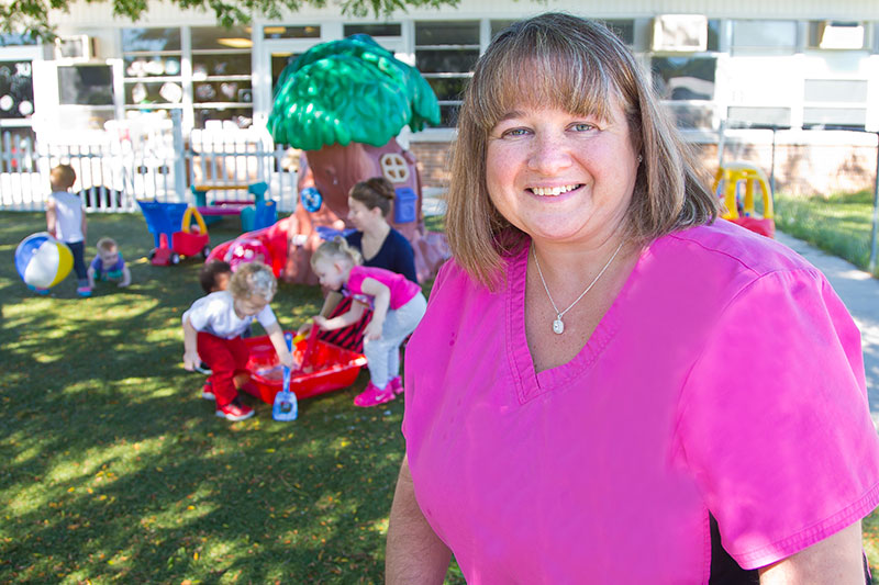 A faculty member smiling.