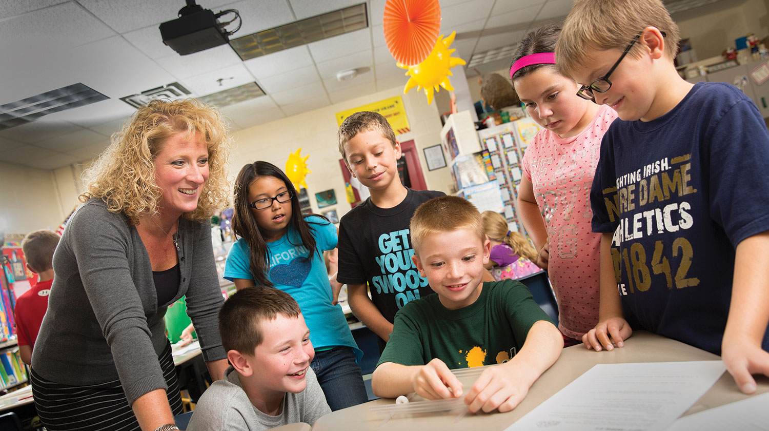 A teacher working with students.