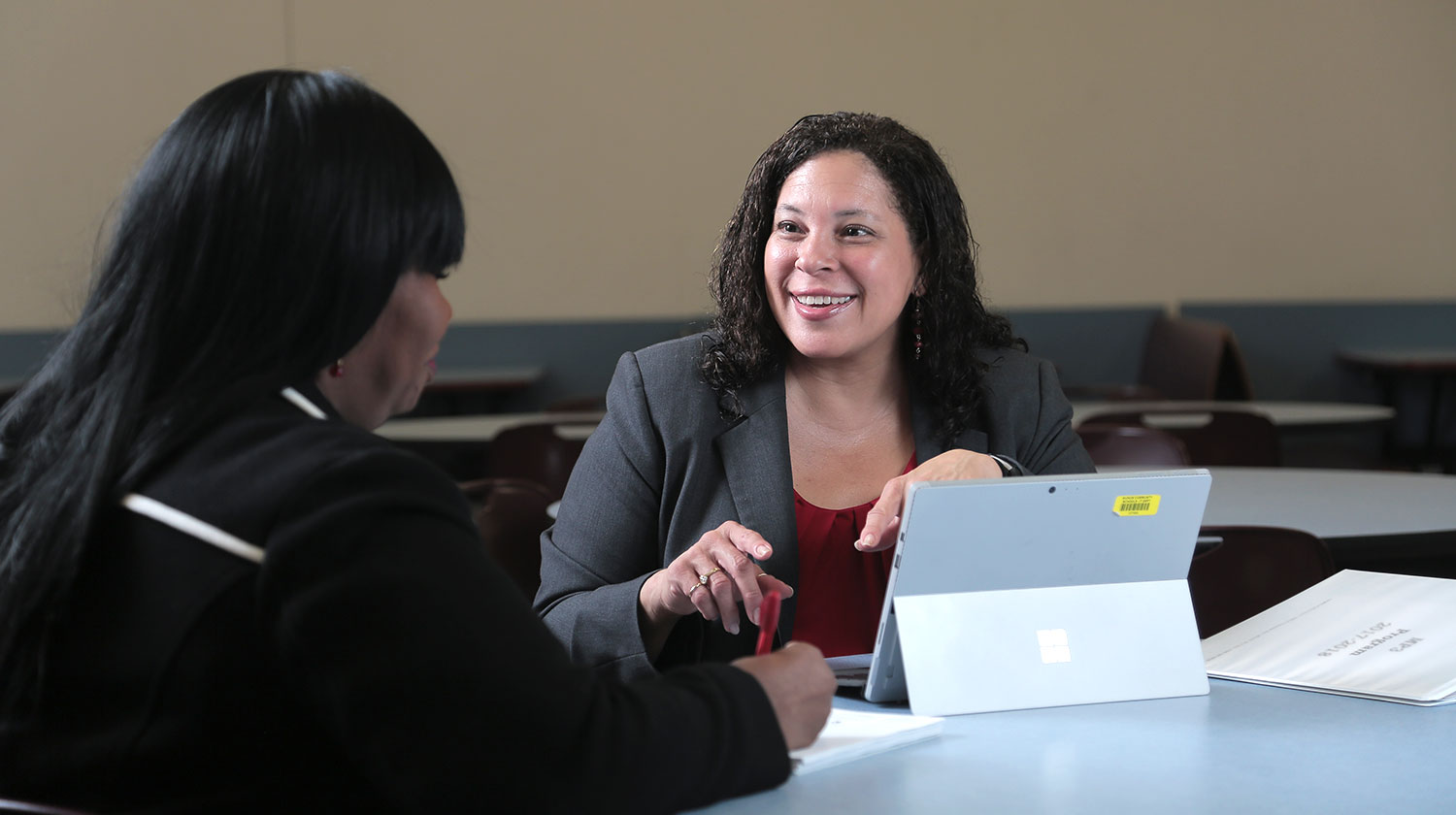 Two education professionals working together.