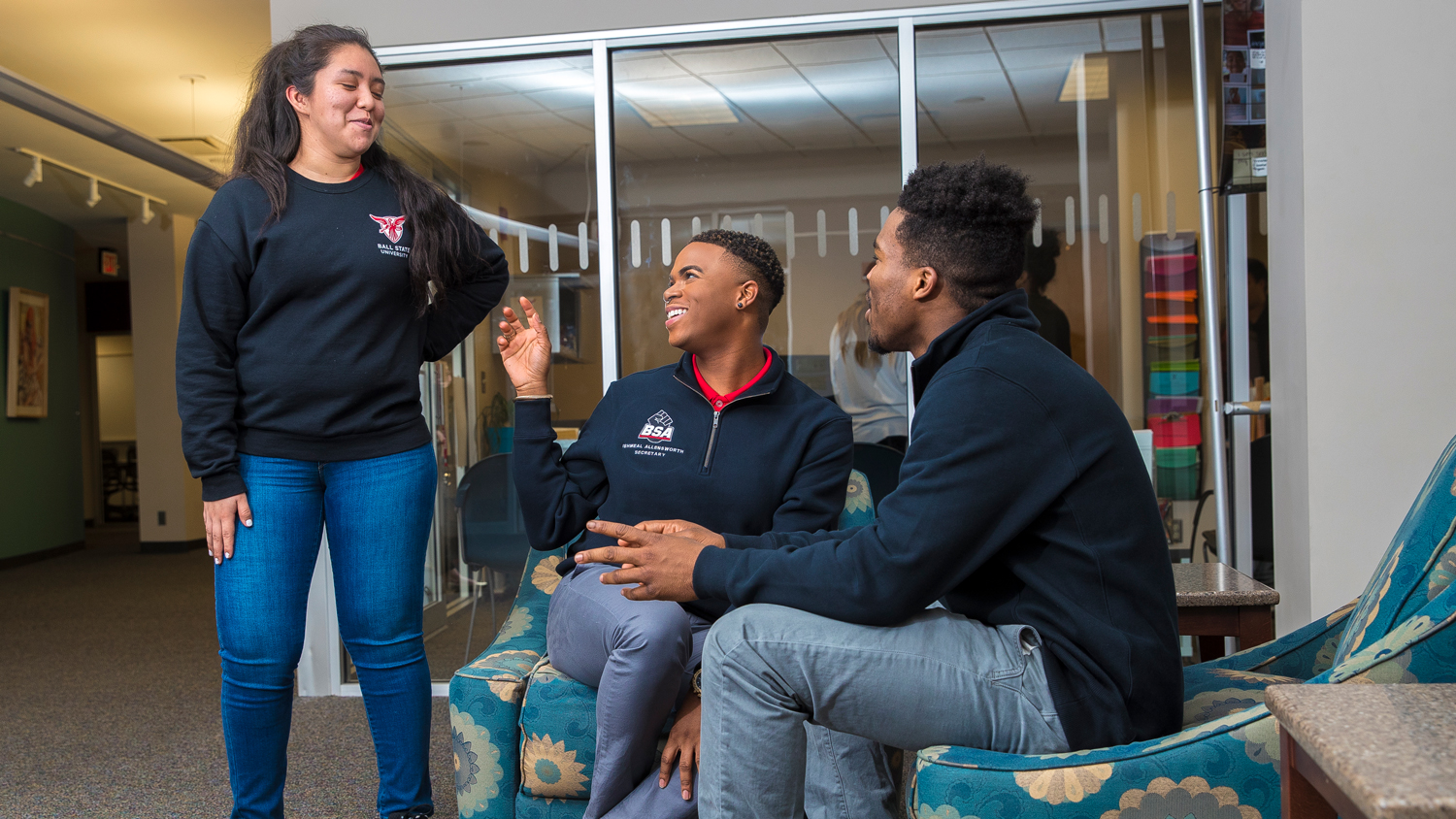 three students talking