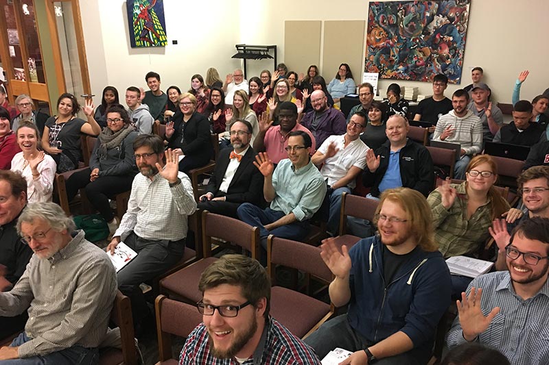 An audience posing for a picture.