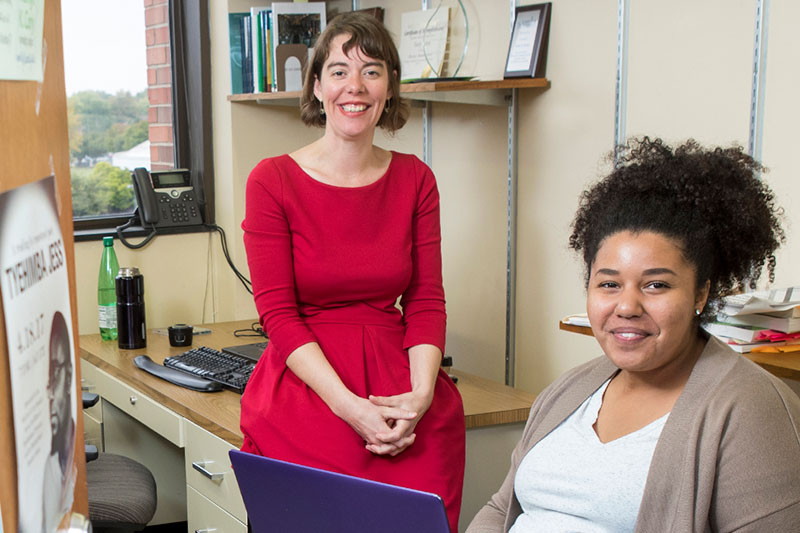 A student and a professor working together.
