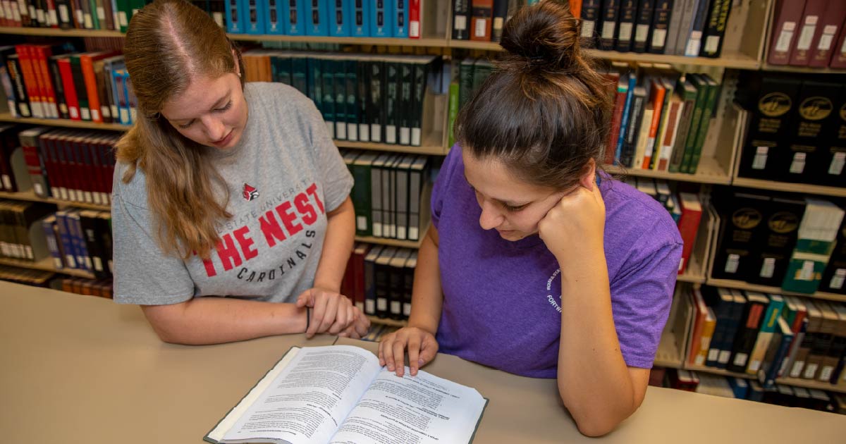 Student browses book at the library.