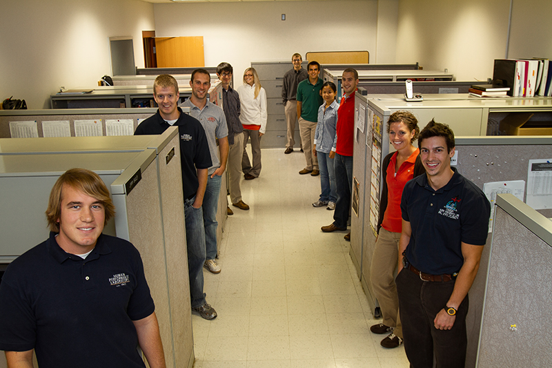 Graduate students in their work space