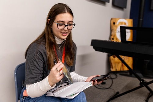 A student looks at a photograph during an interview