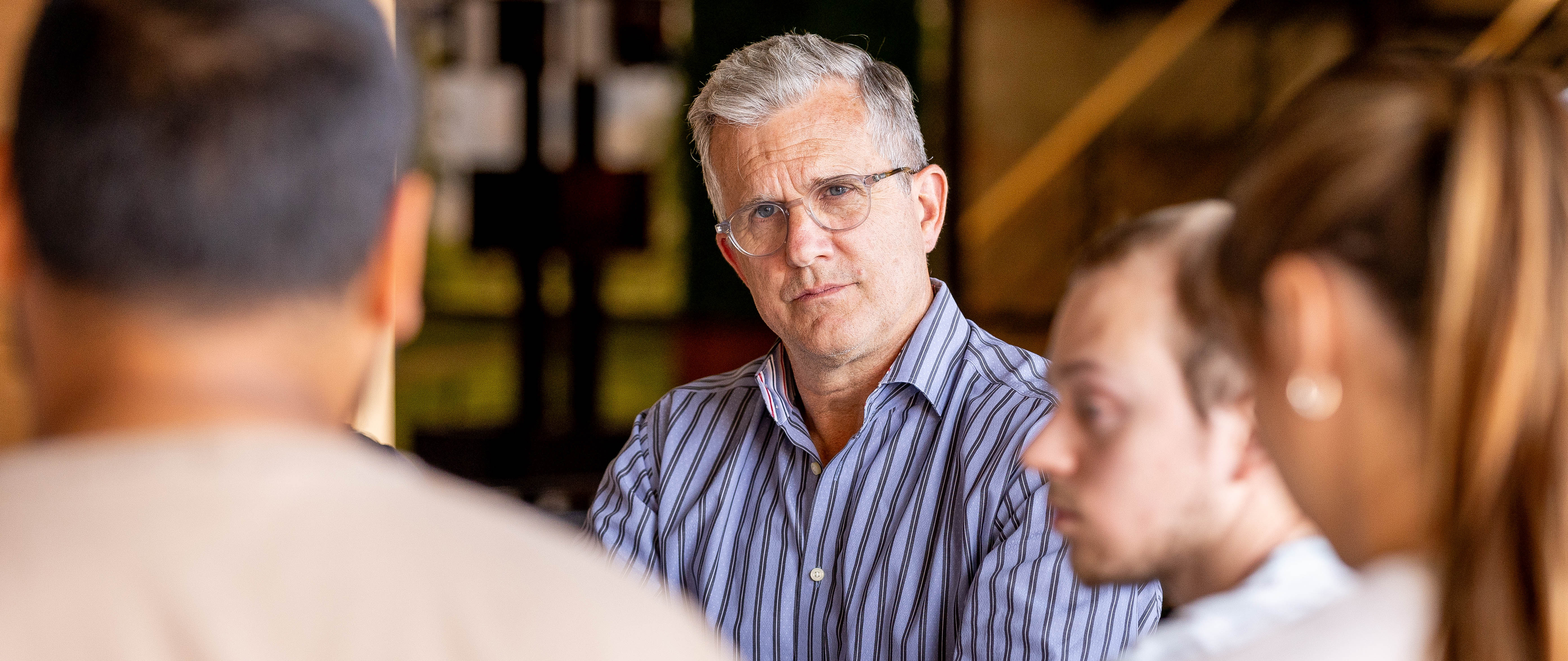 Community Partner listens to a group of students