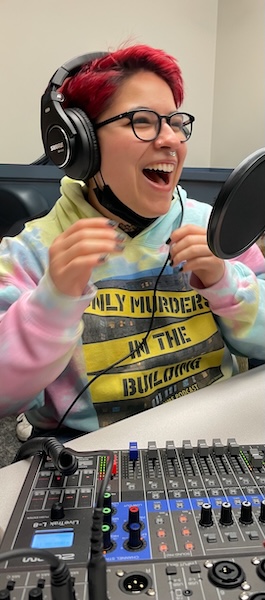 Digital Corps student speaking into a microphone