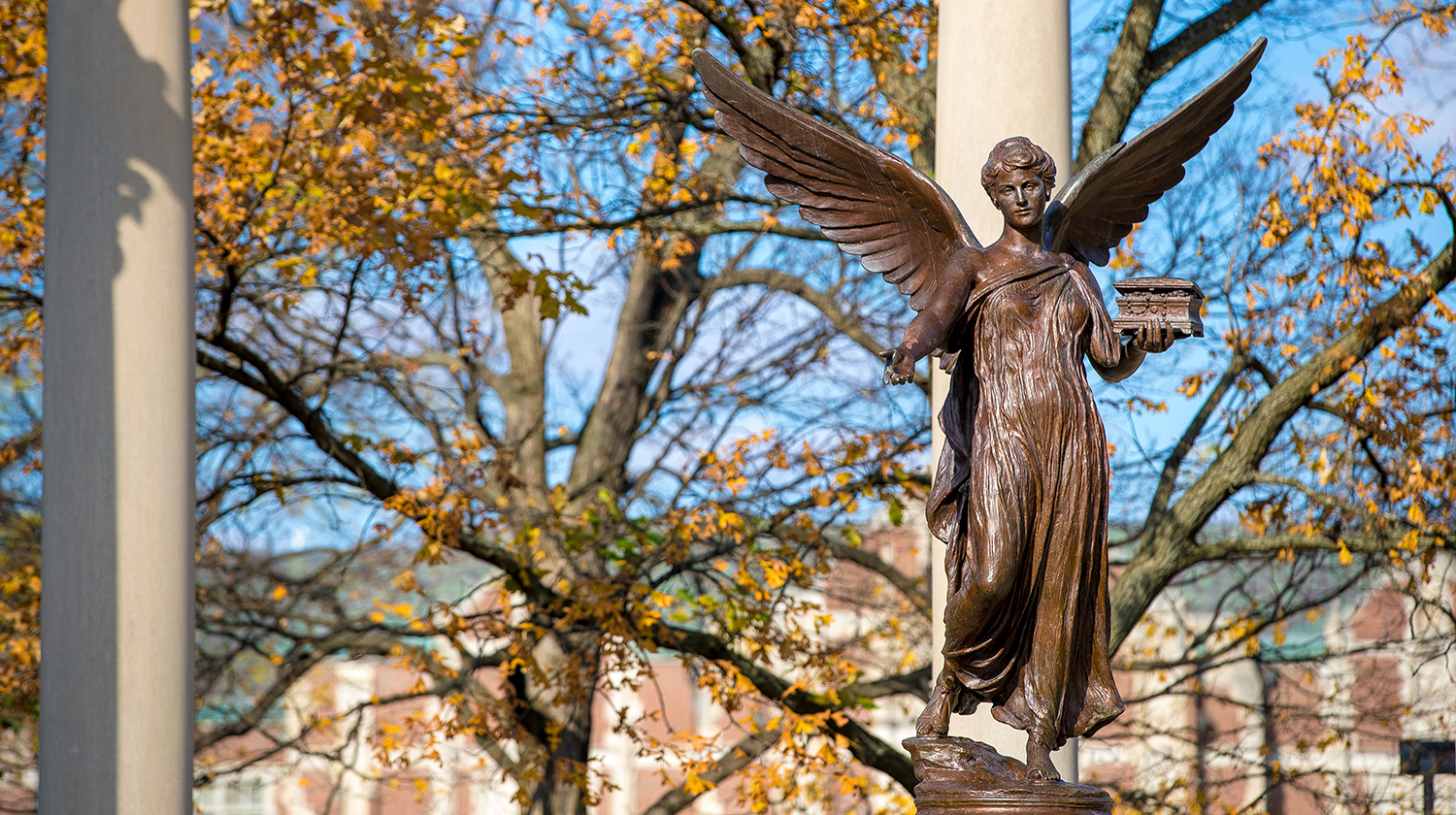 Beneficence statue in the fall