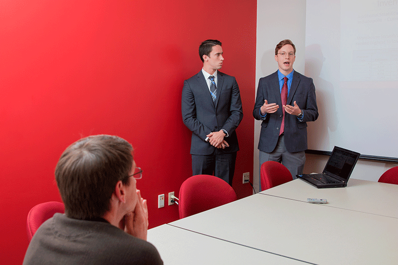 Two students giving a presentation.