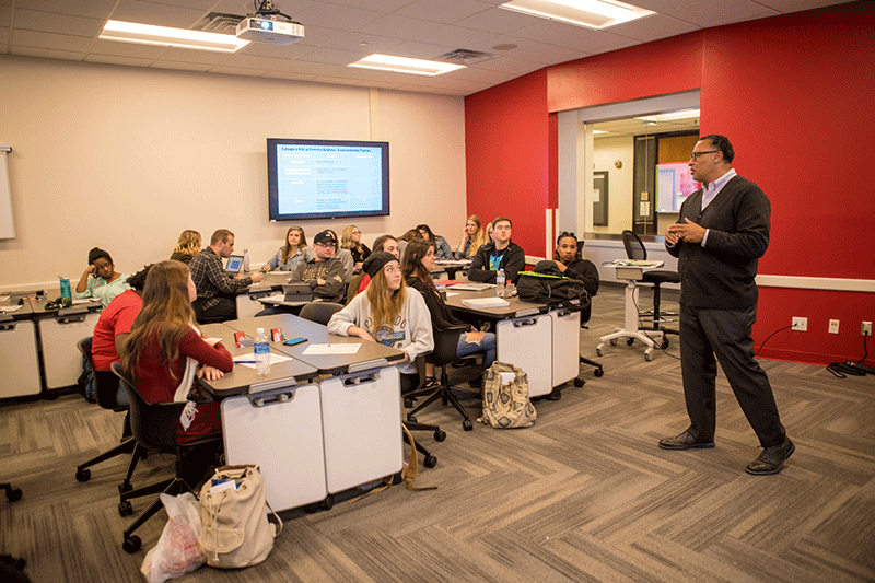 A group of students working in a computer lab.
