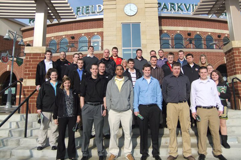 Group of people standing at stadium entrance