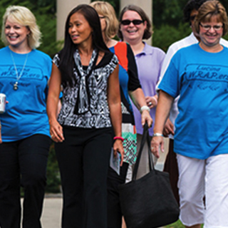 Women walking by Benny.