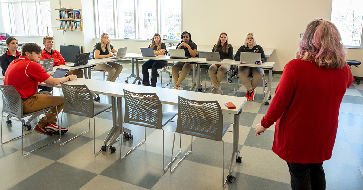 Student and staff working in the Athletic Training Teaching Laboratory