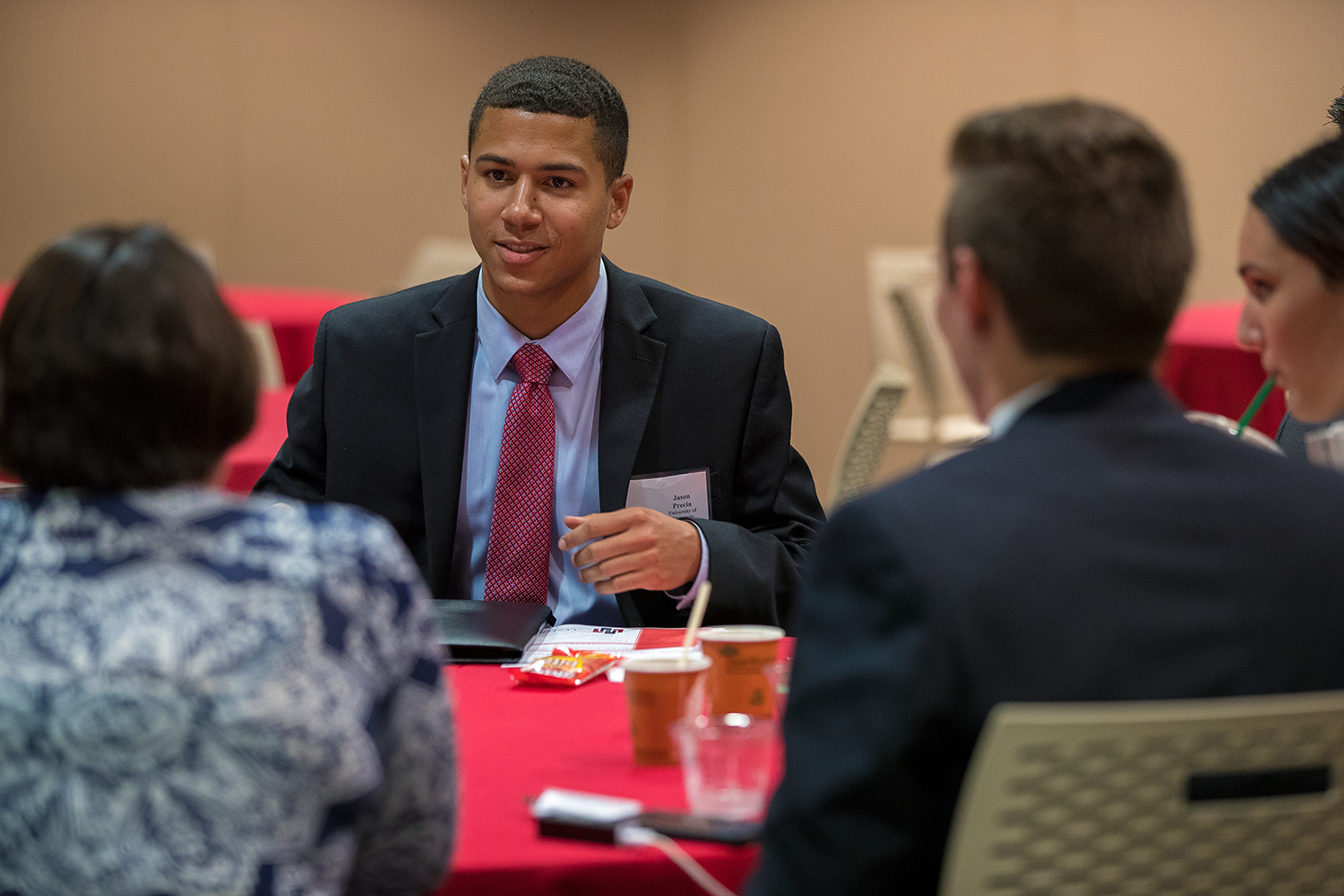 A group of MBA students sitting at a table.