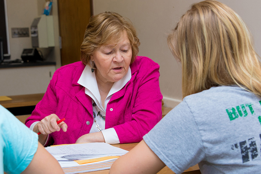 Professor talking to students