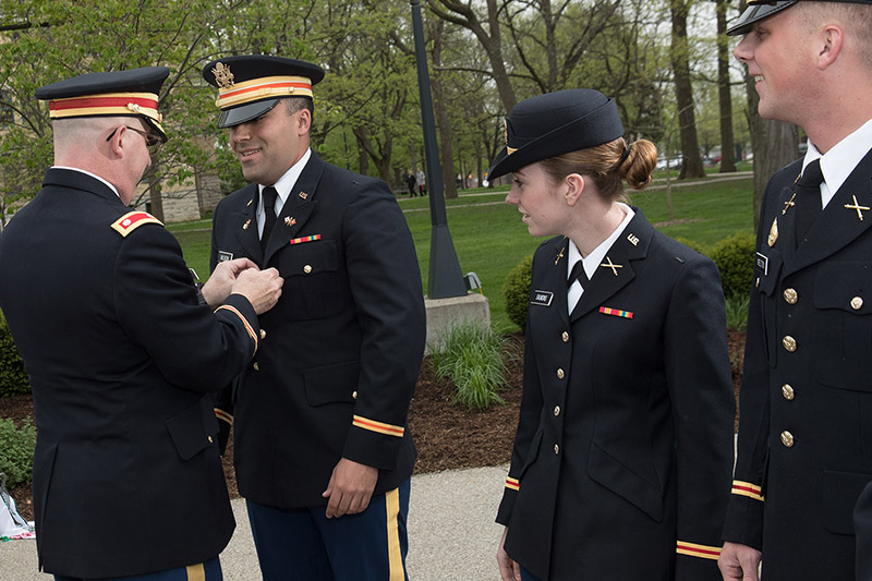 A Military Science student receives an award