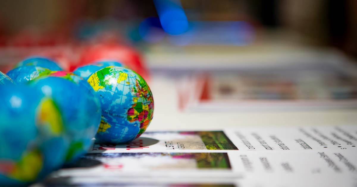 Modern Languages Department information table with mini globes.
