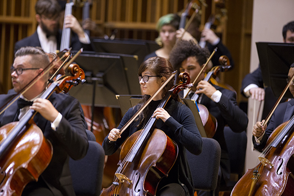 student orchestra performing on stage