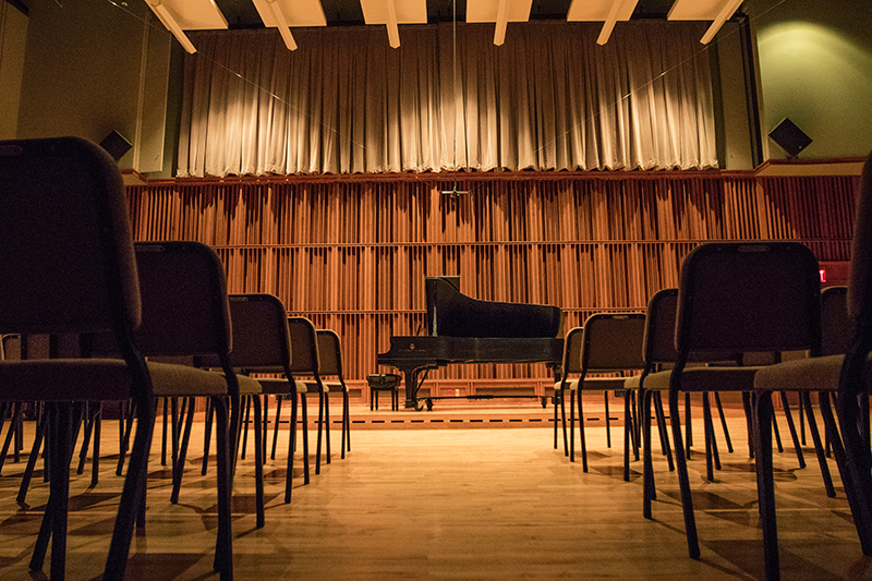 piano and chairs inside Hahn Recital Hall