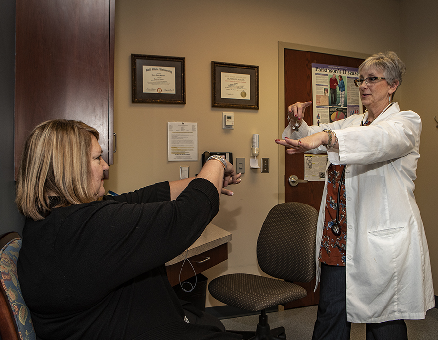 Nursing alumna Karen Springer with a patient