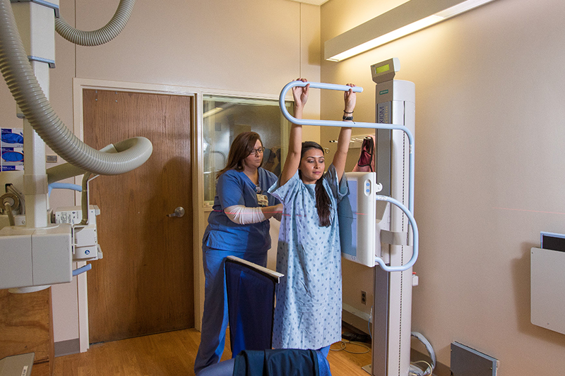 Ball State students look at an x-ray.