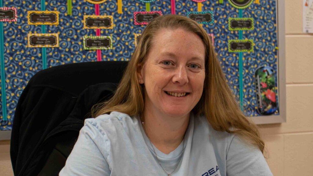 Joleen sitting in an office