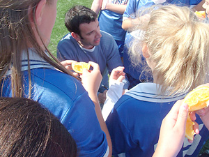 Photo of coach with players