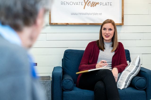 Jenny Anttonen seated with notepad in lap