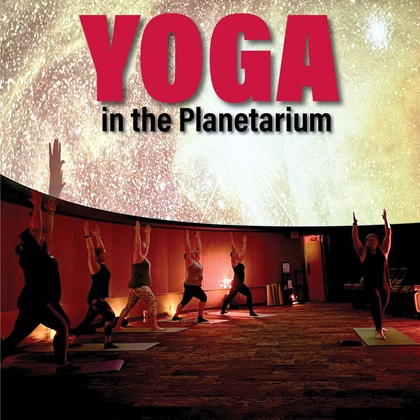 photo of participants doing yoga in planetarium