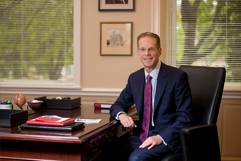 President Mearns at desk in his office