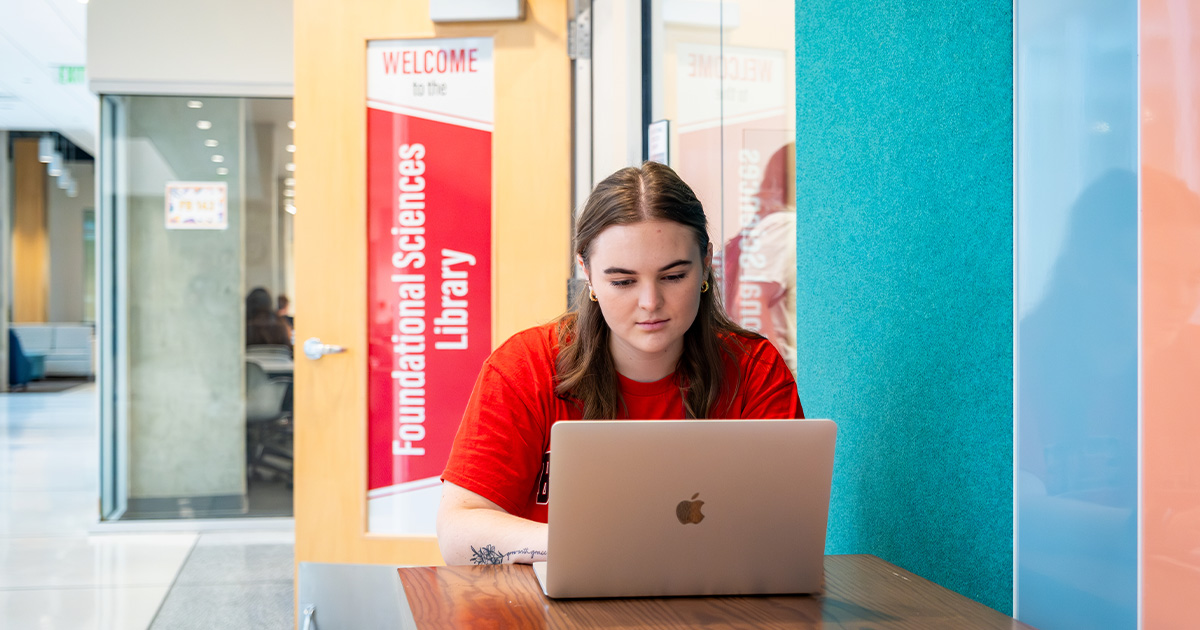 Female student studying on laptop