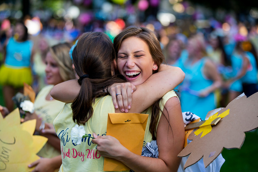 two students hugging each other