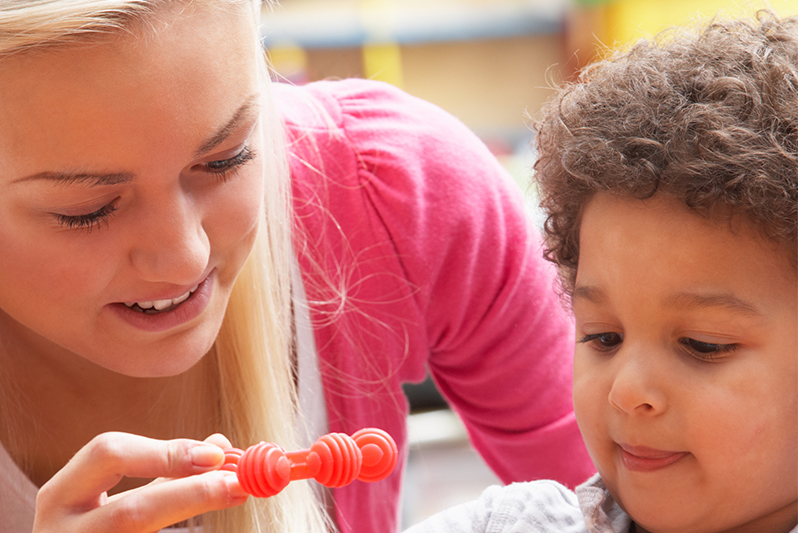 Ball State student working with child