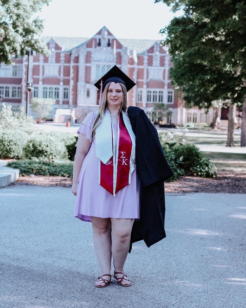 Student with Graduation Gown and program stole