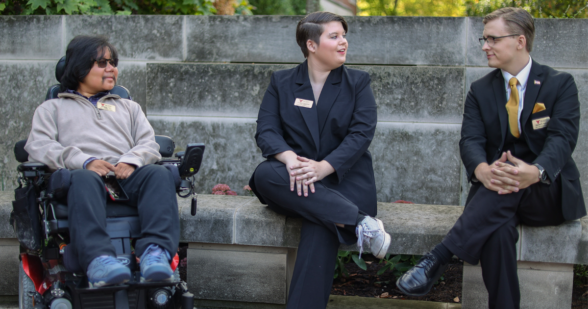 Student government executives engaged in a discussion with a student body leader