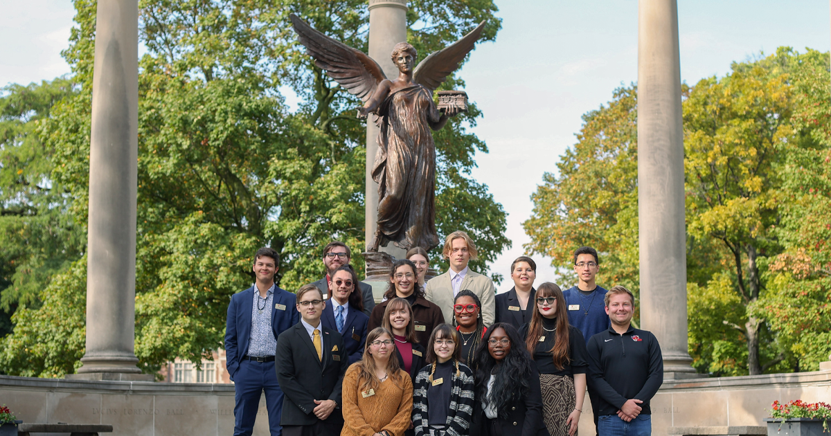 Some 2022-2023 student government executives posing for photos in front of Beneficence