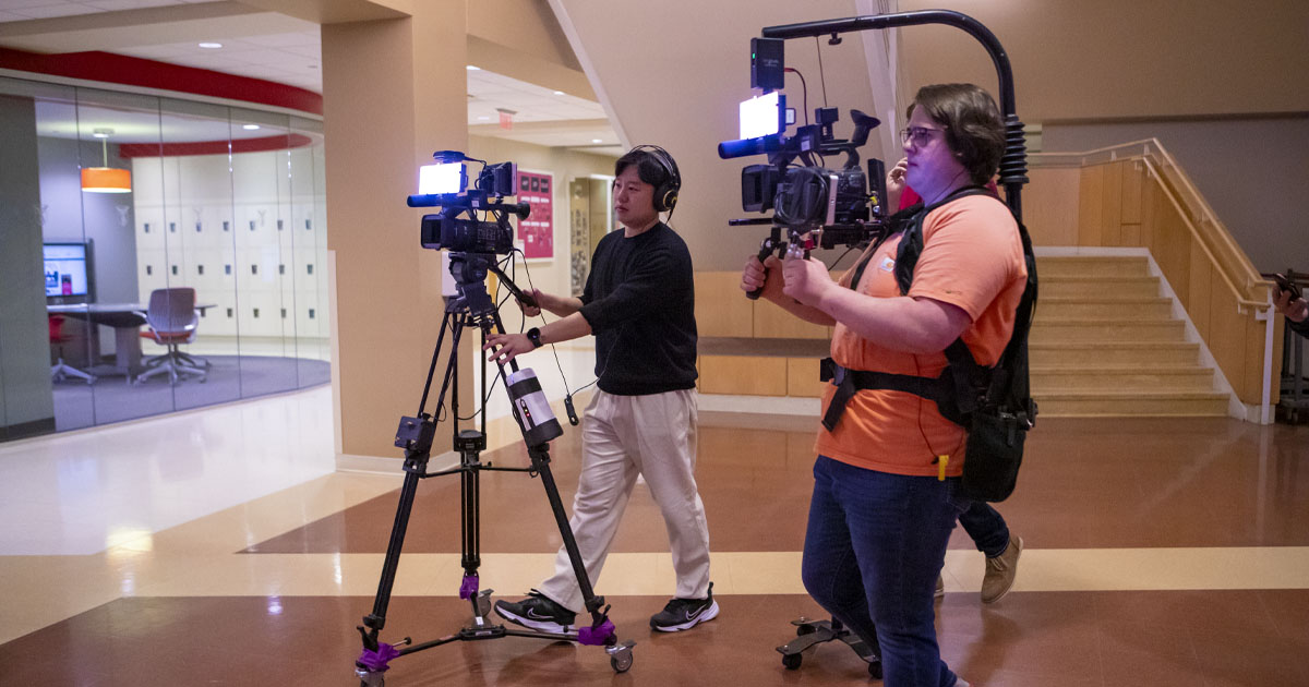 Students with cameras at super party